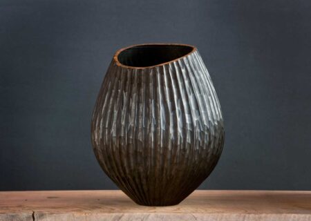 Hand-carved Taraire vessel with sculptural rim and contrasting natural wood tones.