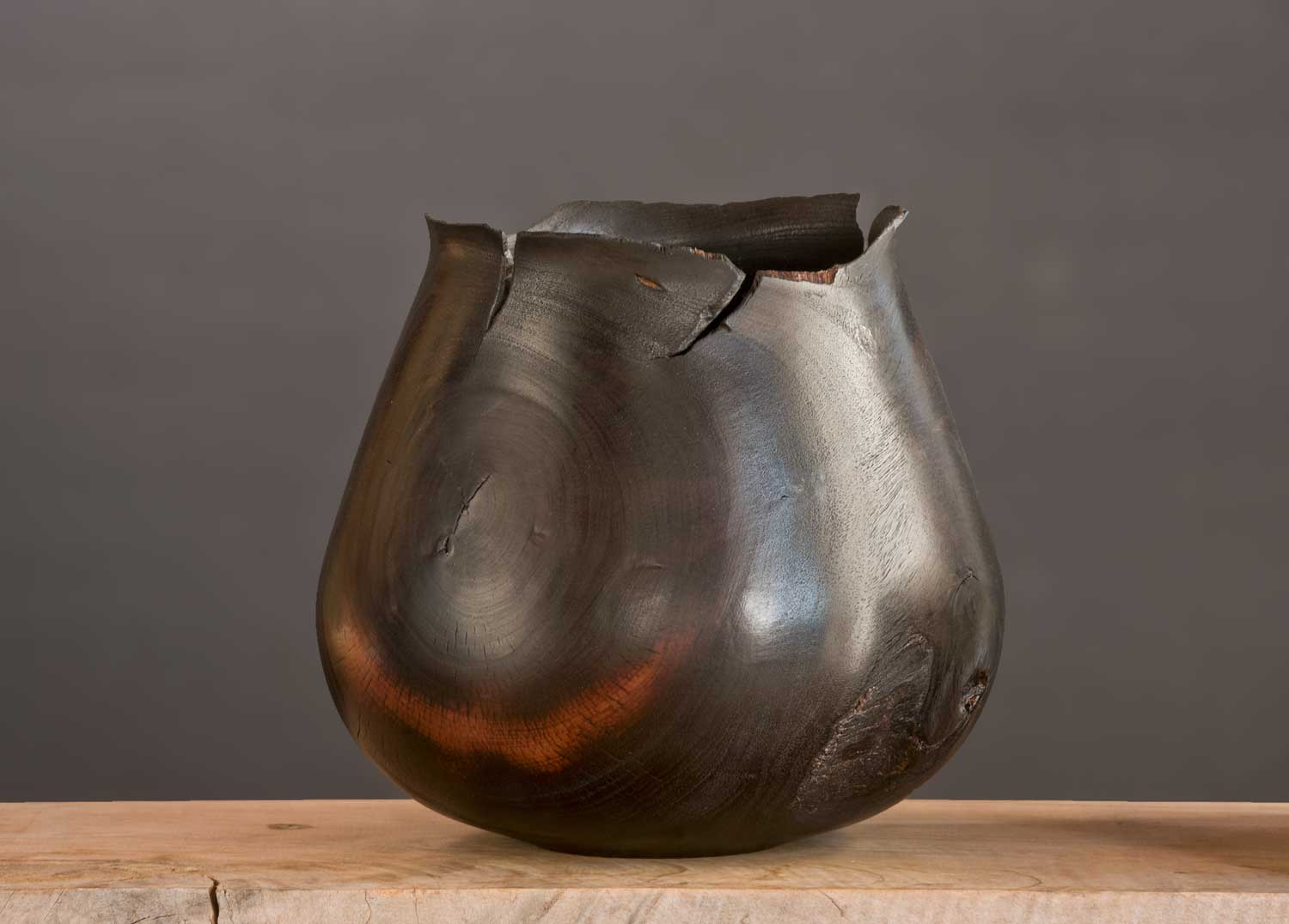 Wooden-Artefact-BB07 Cracked and sculpted vessel with dramatic flame-shaped rim and rich black surface.